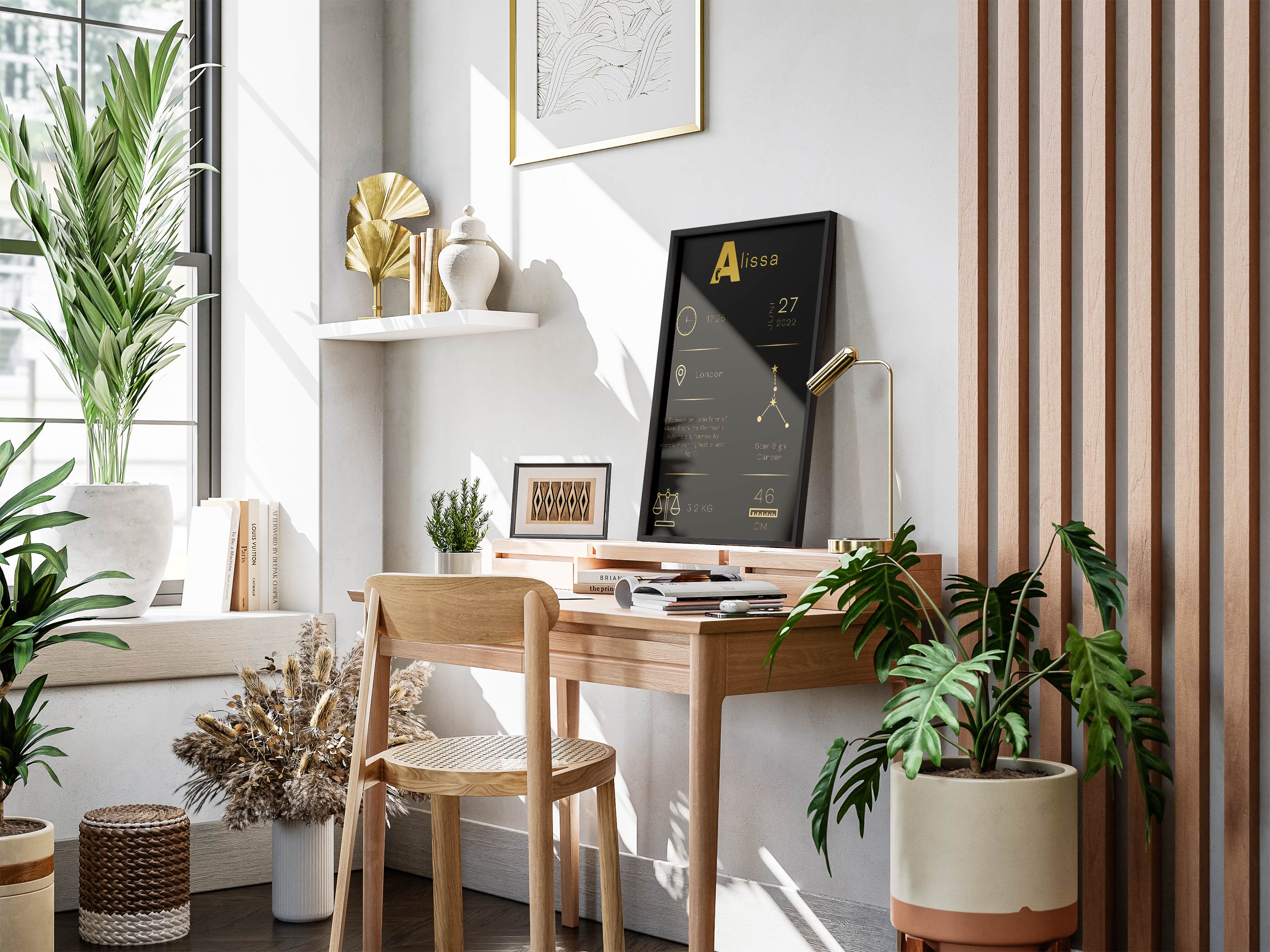 A bright home office with a wooden desk, green plants, and a personalized gold and black artwork on the wall.