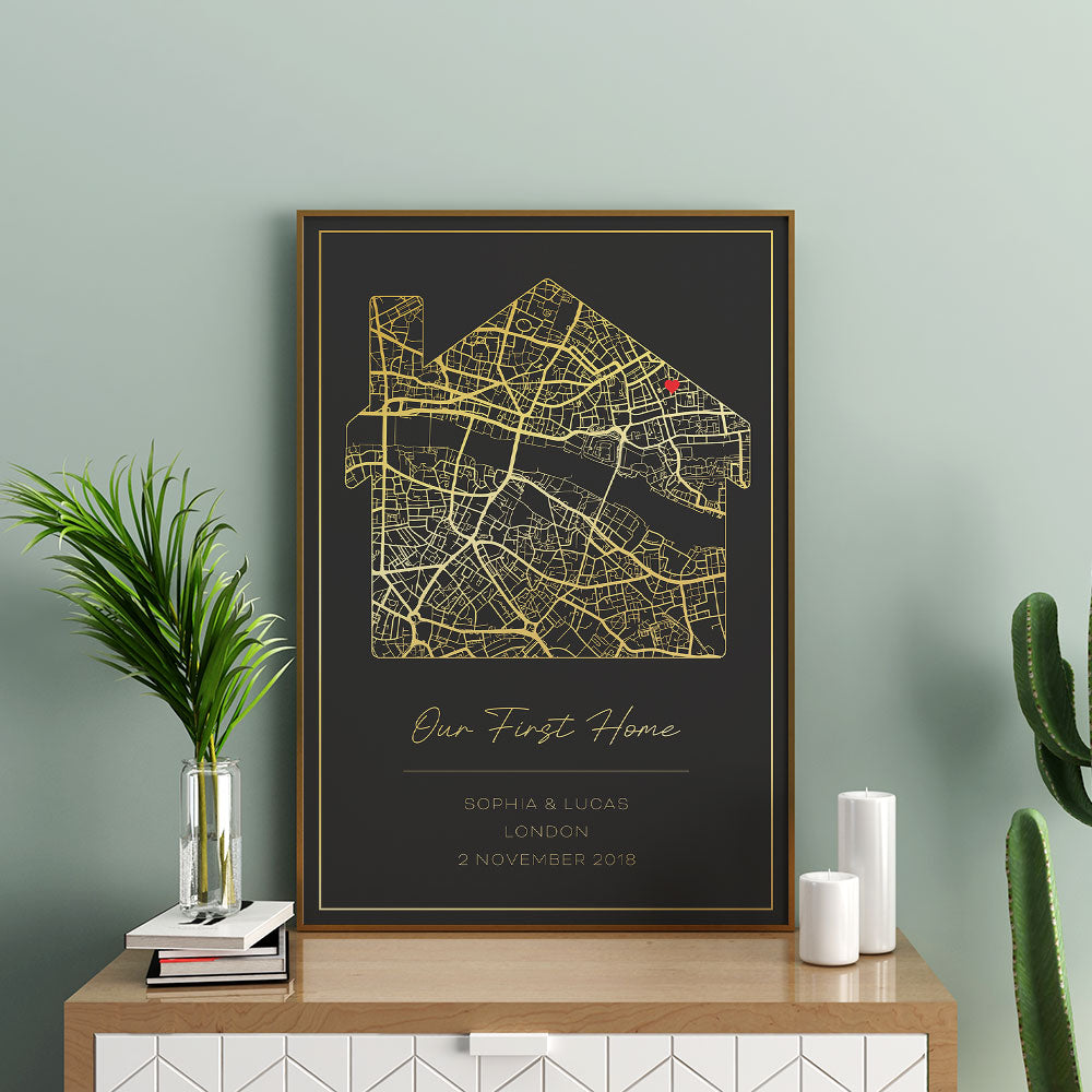 Custom map print marking 'Our First Home' with a red pin, personalised with names and date in gold.